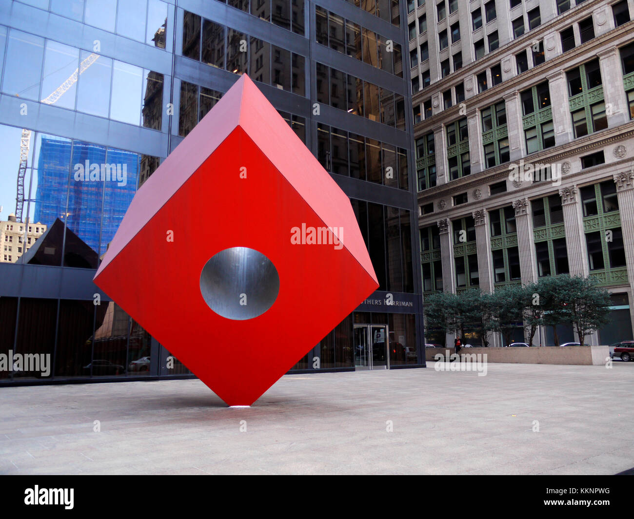 Red Cube, a 1968 sculpture by Isamu Noguchi which sits on Broadway, between Liberty and Cedar streets in New York's financial district. Stock Photo