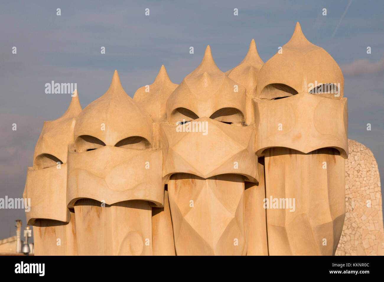 The rooftop chimneys of Casa Milà, also known as La Pedreral, a modernist building designed by architect Antoni Gaudí in Barcelona, Catalonia, Spain Stock Photo