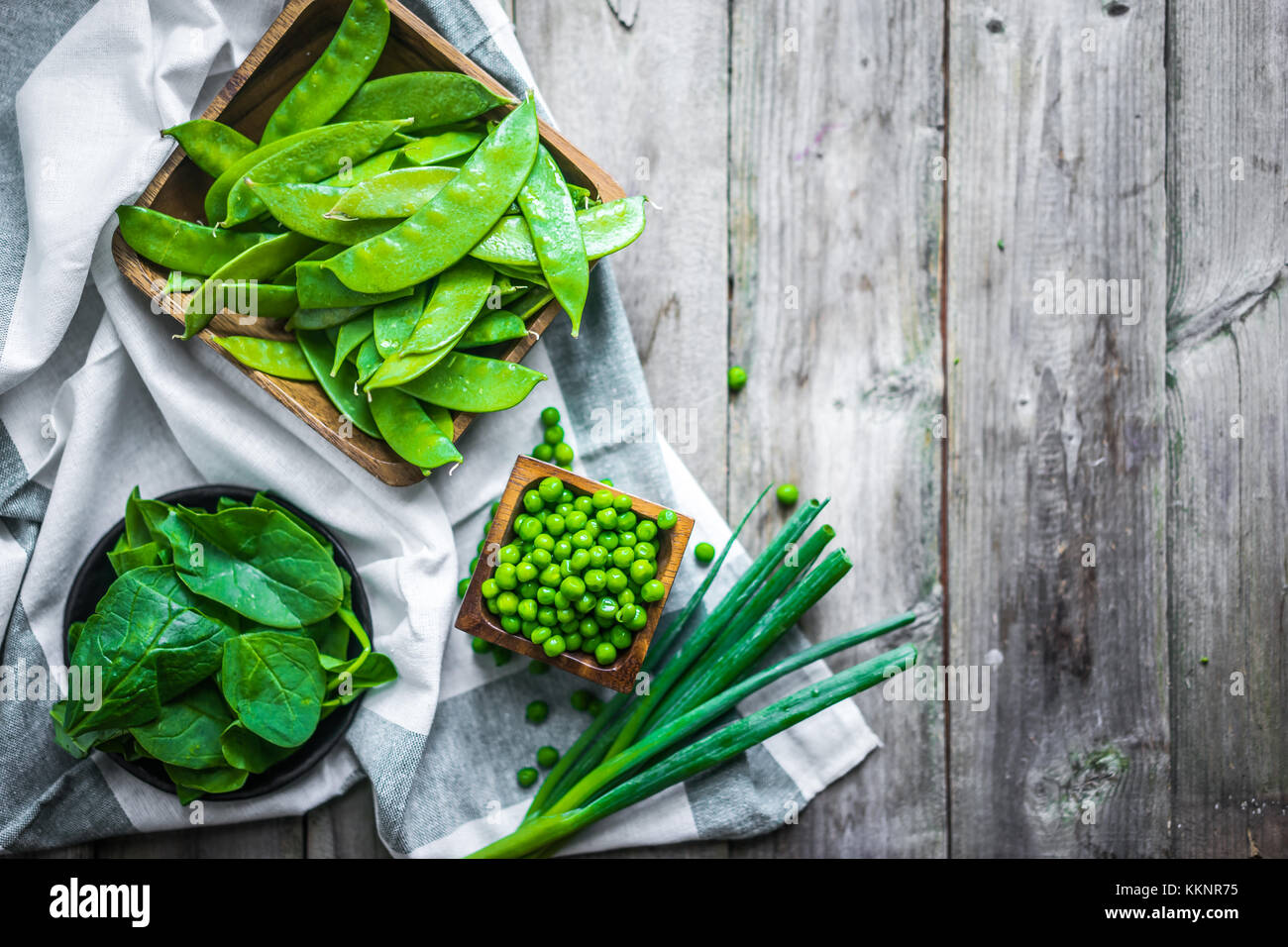 Green vegetables on wooden background Stock Photo