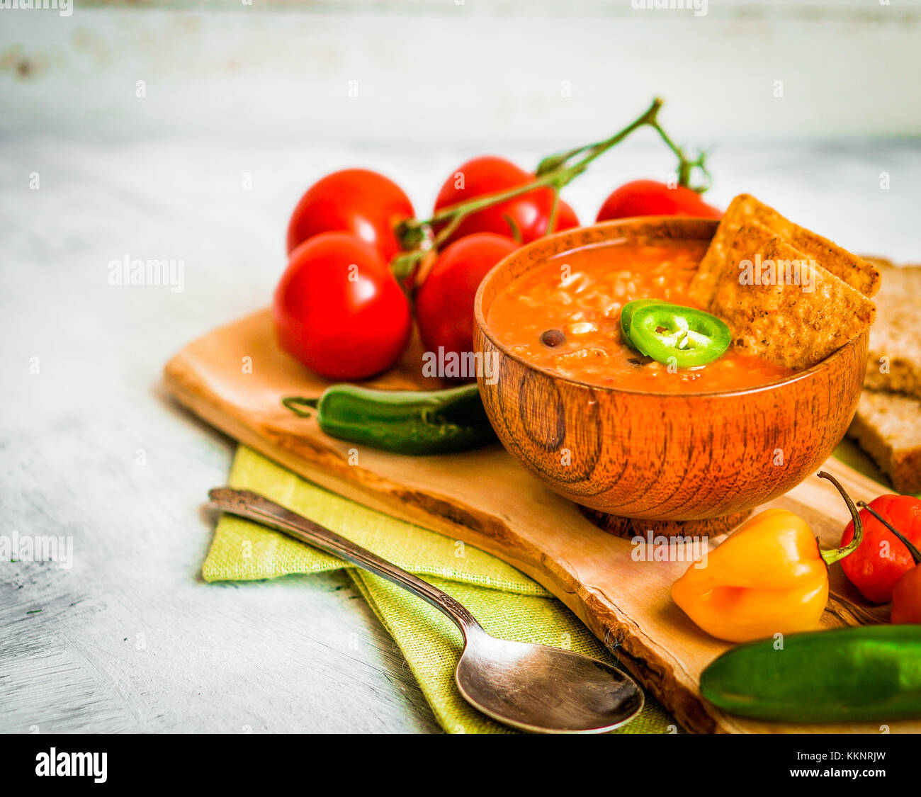 Hot And Spicy Fresh Made Mexican Chili Soup On Rustic Background Stock Photo