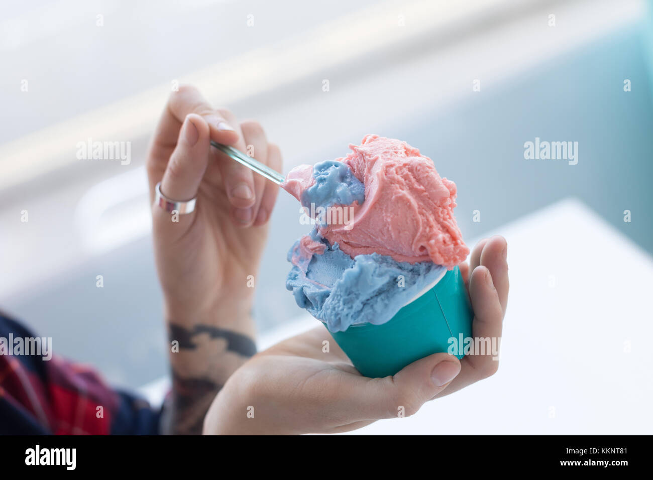 Woman holding double scoop ice cream in hand Stock Photo