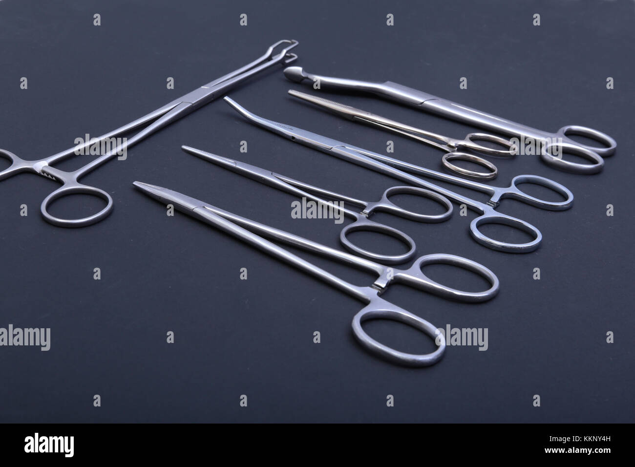 Round Doctors Instruments Medical and surgery instruments isolated in black mirror background ...