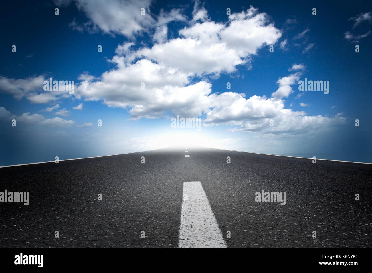 Asphalt road and blue sky with clouds Stock Photo - Alamy