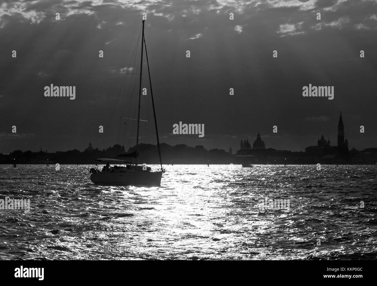 boat sailing in the sea with backlit and Black and White photographic ...