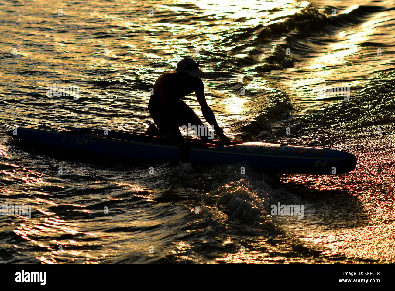 Stand up paddle surfing and stand up paddle boarding (SUP Stock Photo