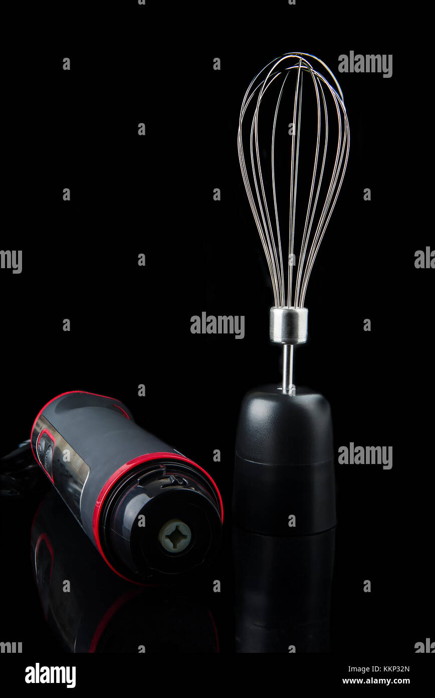 Electric hand blender, isolated on a black background Stock Photo Alamy