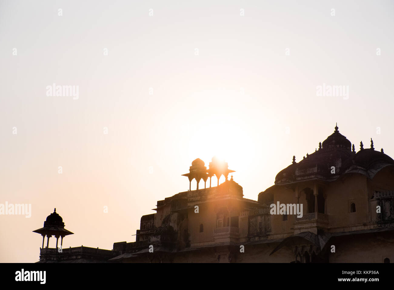 Turrets and cupolas of an Indian Palace aginst a sunset, Bundi, Rajasthan,India Stock Photo
