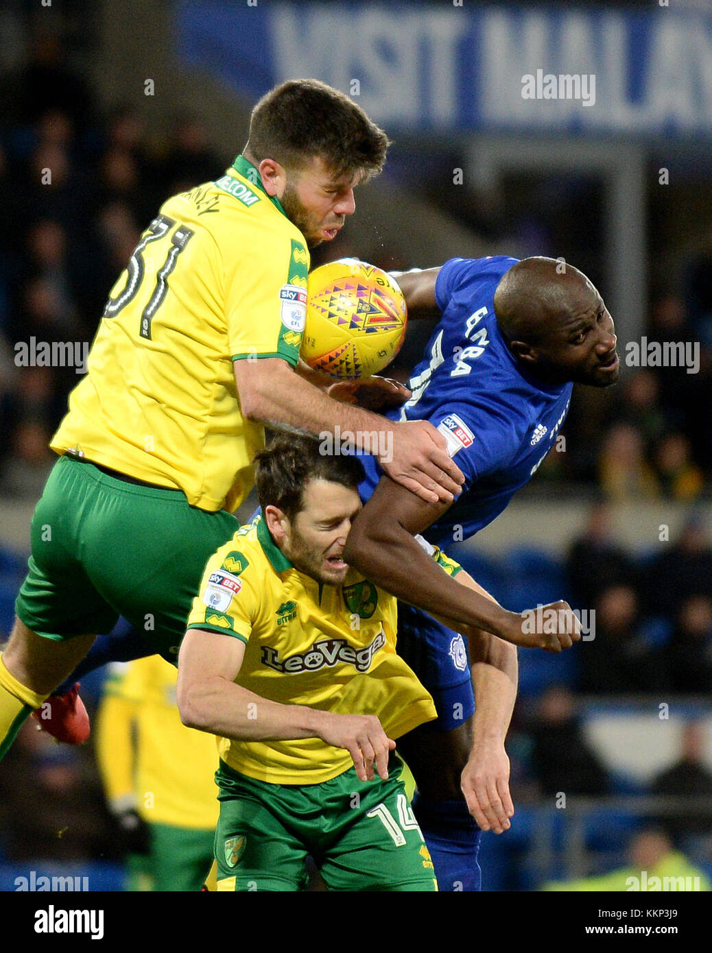 Norwich City's Grant Hanley (top left) and Wes Hoolahan battle for the ball with Cardiff City's Sol Bamba during the Sky Bet Championship match at the Cardiff City Stadium, Cardiff. PRESS ASSOCIATION Photo Picture date: Friday December 1, 2017. See PA story SOCCER Cardiff. Photo credit should read: Simon Galloway/PA Wire. RESTICTIONS: No use with unauthorised audio, video, data, fixture lists, club/league logos or 'live' services. Online in-match use limited to 75 images, no video emulation. No use in betting, games or single club/league/player publications. Stock Photo