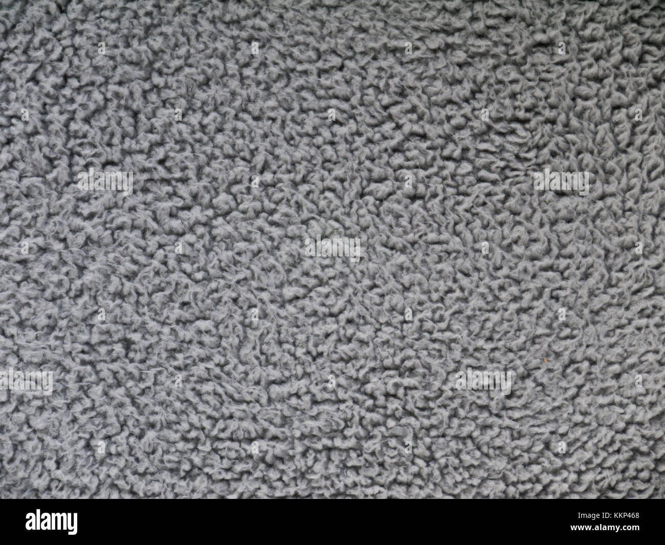 Gray faux shearling fabric texture. Artificial sheepskin Stock Photo