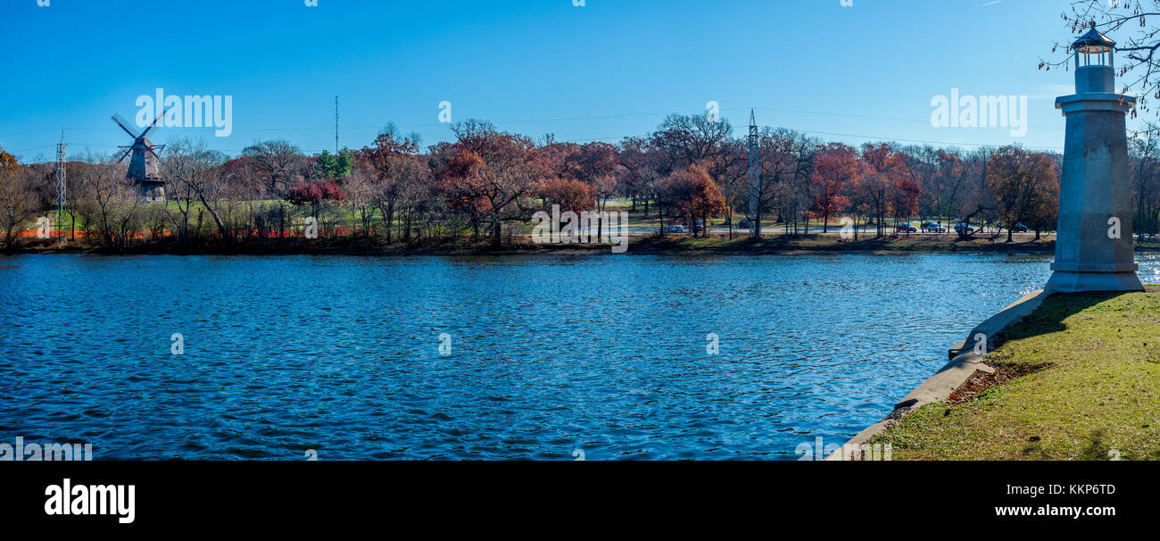 View across the Fox River near Geneva Illinois showing both the historic windmill and lighthouse. Stock Photo