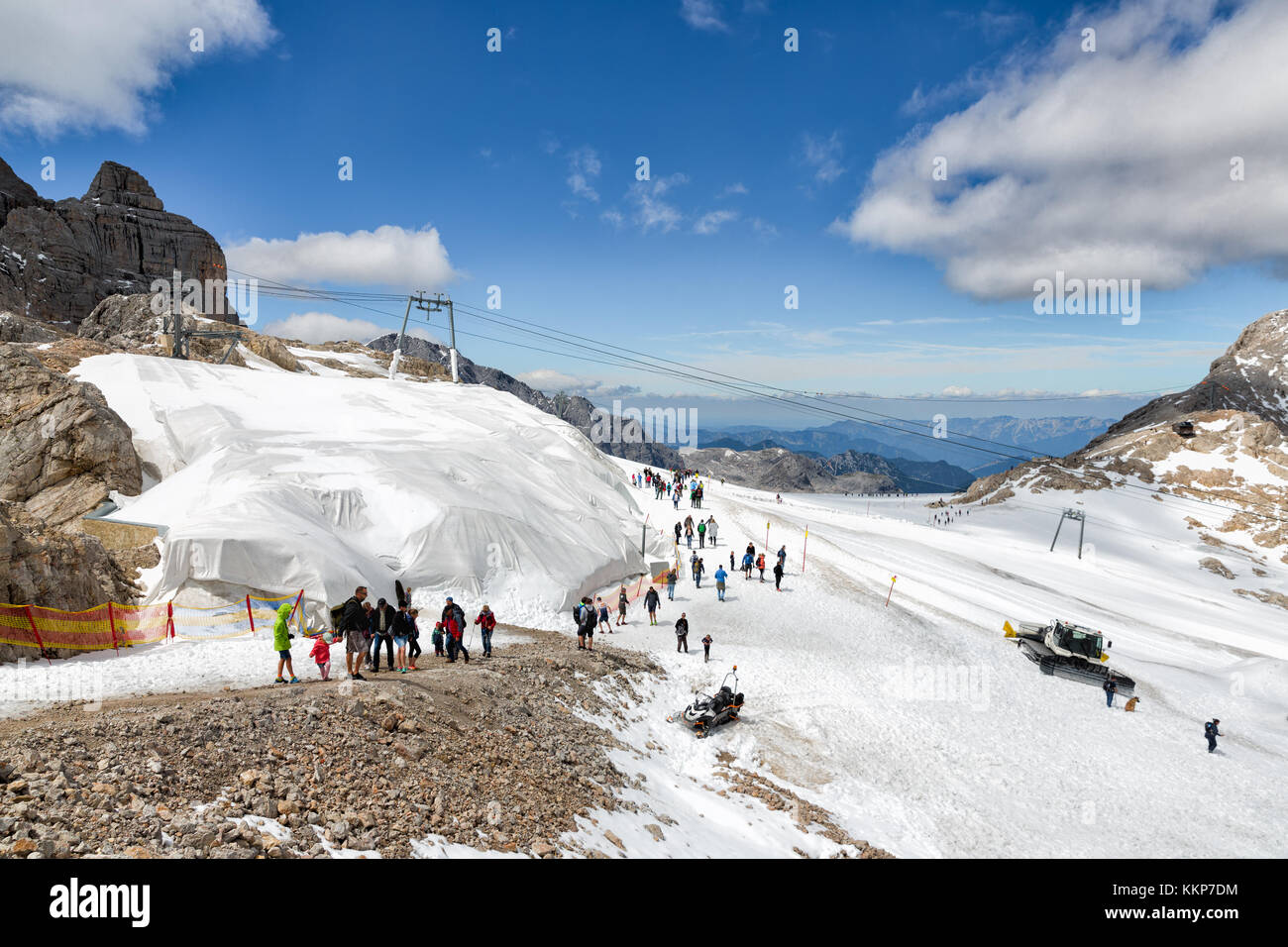 Dachstein Mountain in Austria with hikers exploring the glacier Stock ...