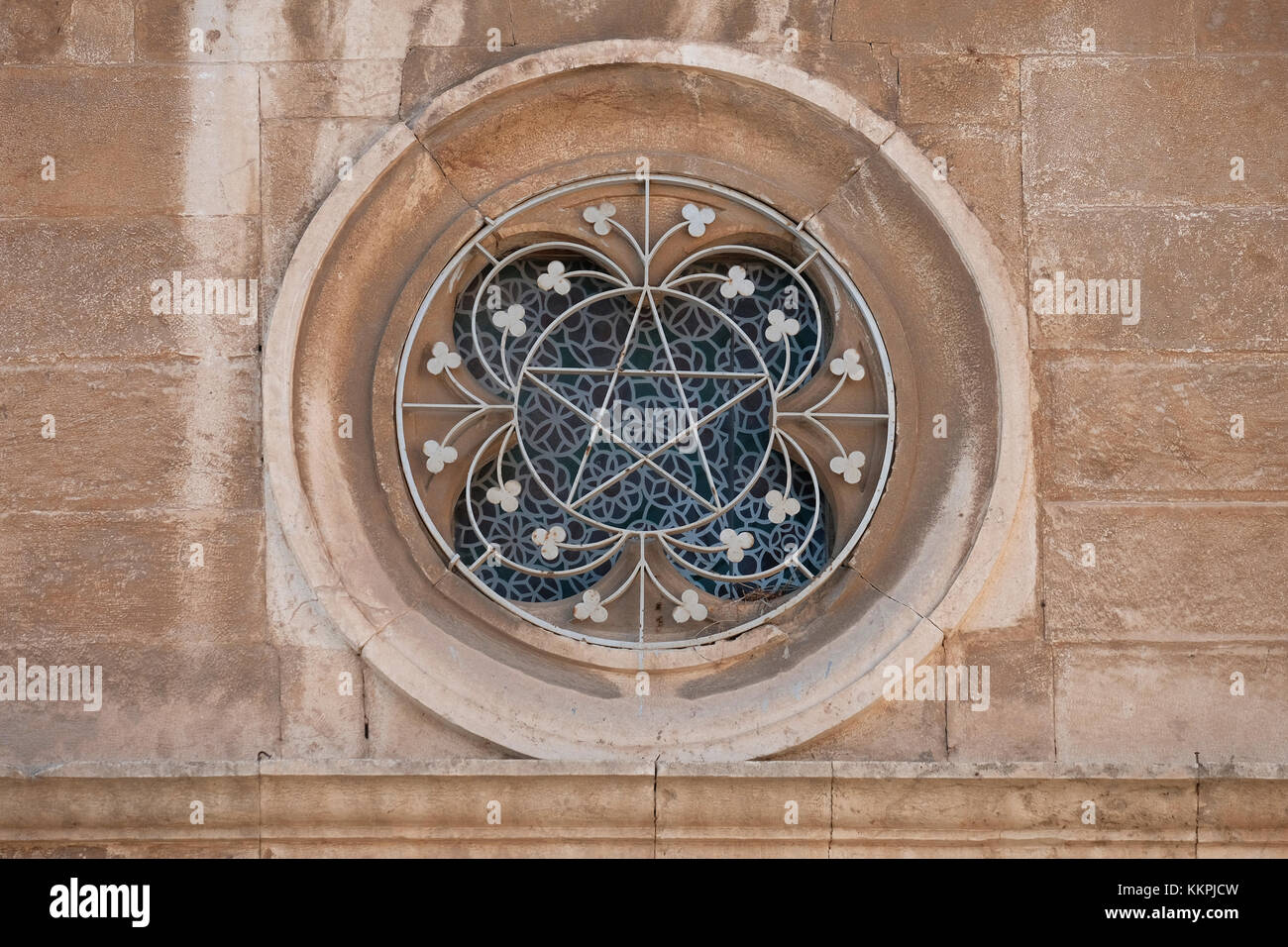 Quatrefoil shaped window above the main entrance to the Franciscan Boys
