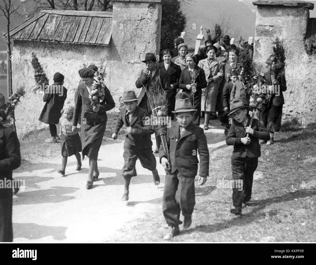 This image depicts a scene from Butare in 1940, where a procession is ...