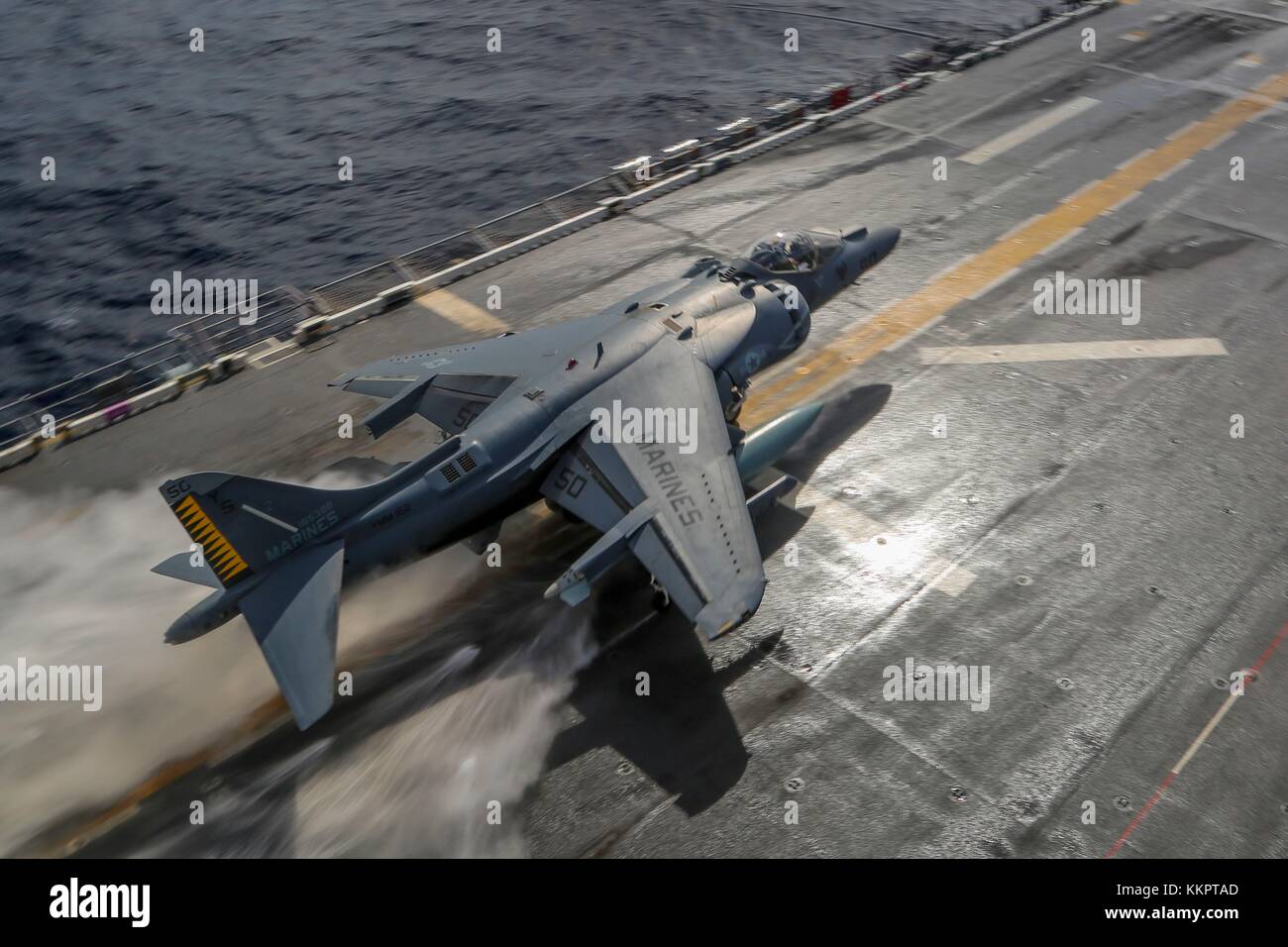 A U.S. Marine Corps AV-8B Harrier II ground-attack aircraft takes off from the flight deck of the U.S. Navy Wasp-class amphibious assault ship USS Iwo Jima November 24, 2017 in the Atlantic Ocean.  (photo by Jon Sosner via Planetpix) Stock Photo