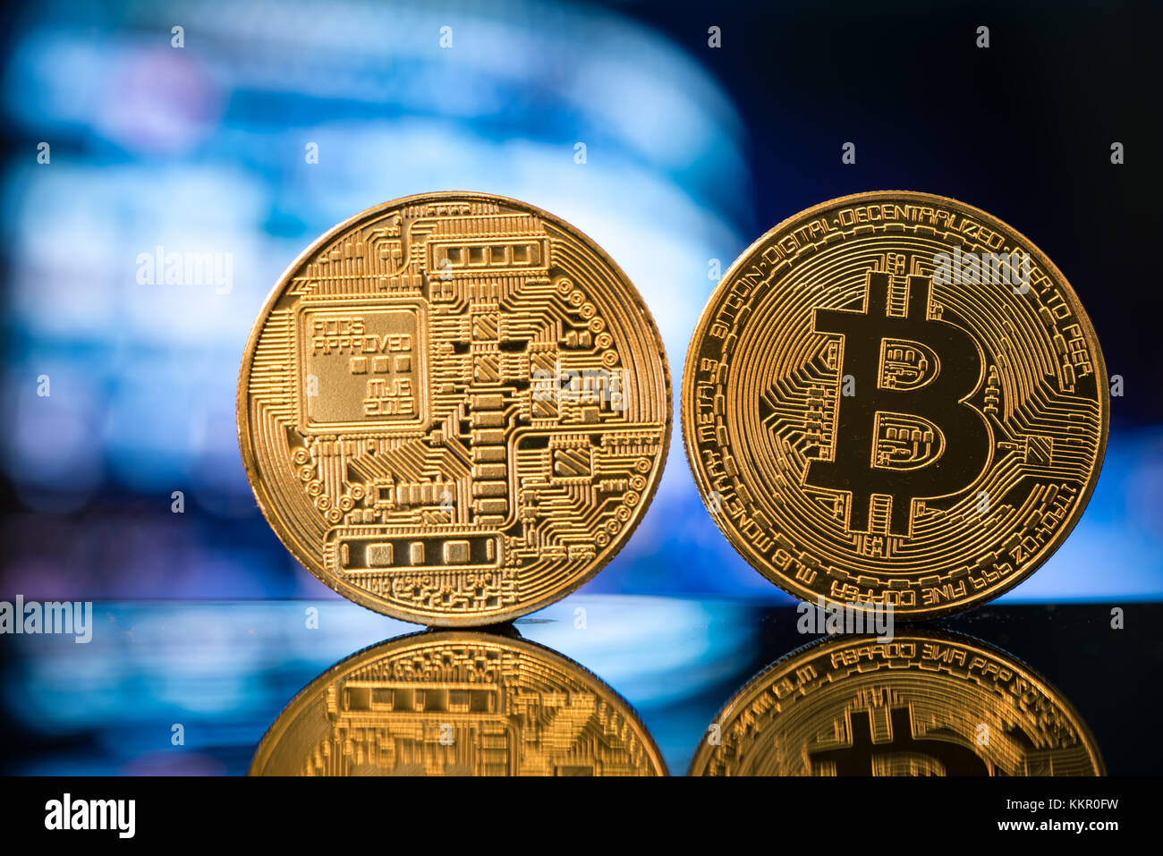 Bitcoin close up two sides Stock Photo - Alamy