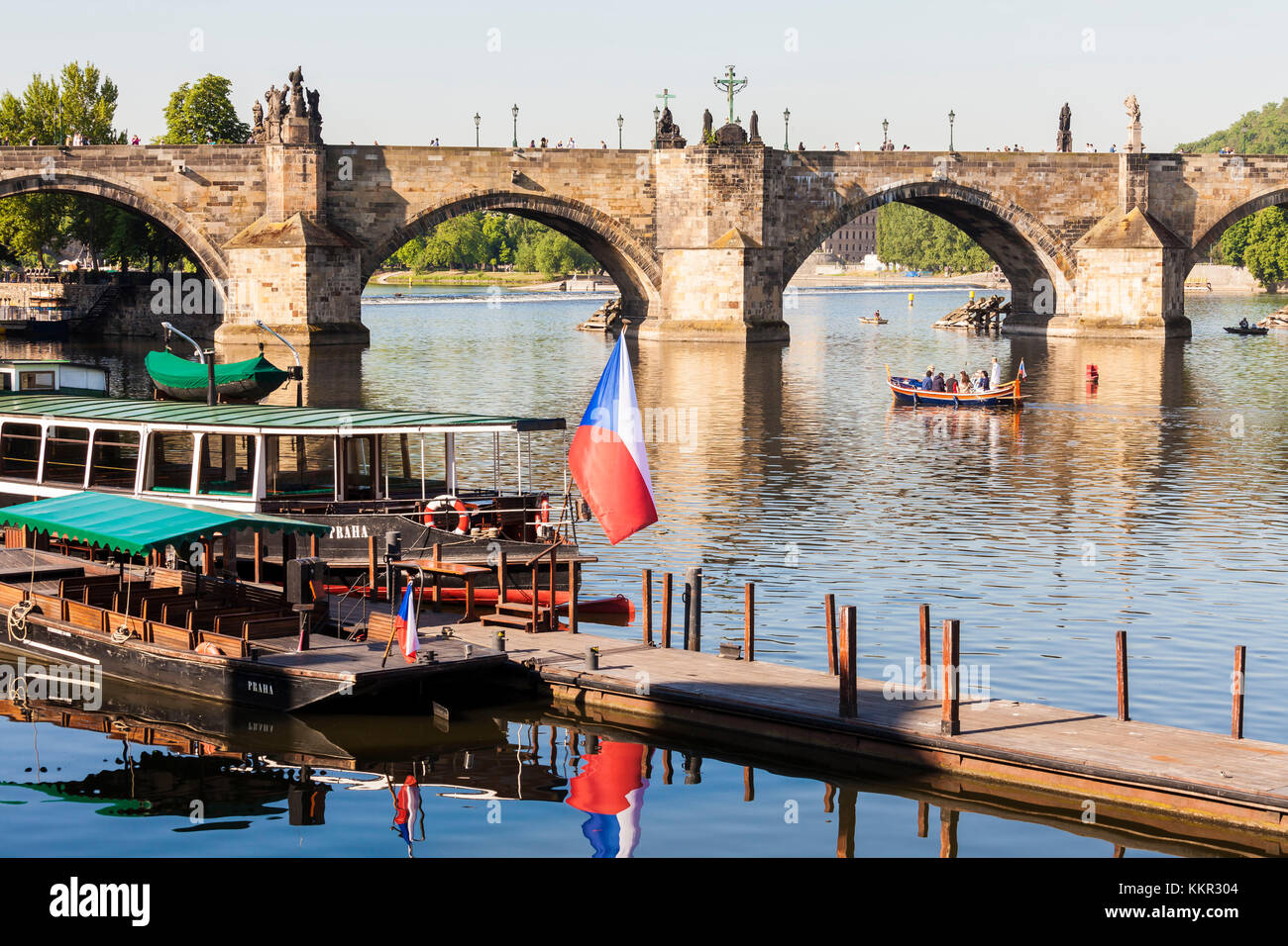 Czechia, Prague, Vltava, Charles Bridge, excursion boats, boat, Czech flag Stock Photo