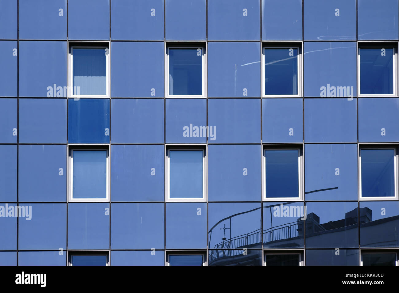 The reflexion of buildings in the modern facade of an office building and residential house. Stock Photo