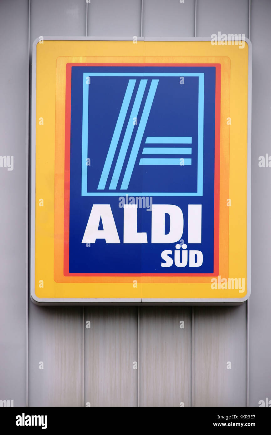 The bright company logo of the food discount shop Aldi Süd at the tin facade of a food market. Stock Photo
