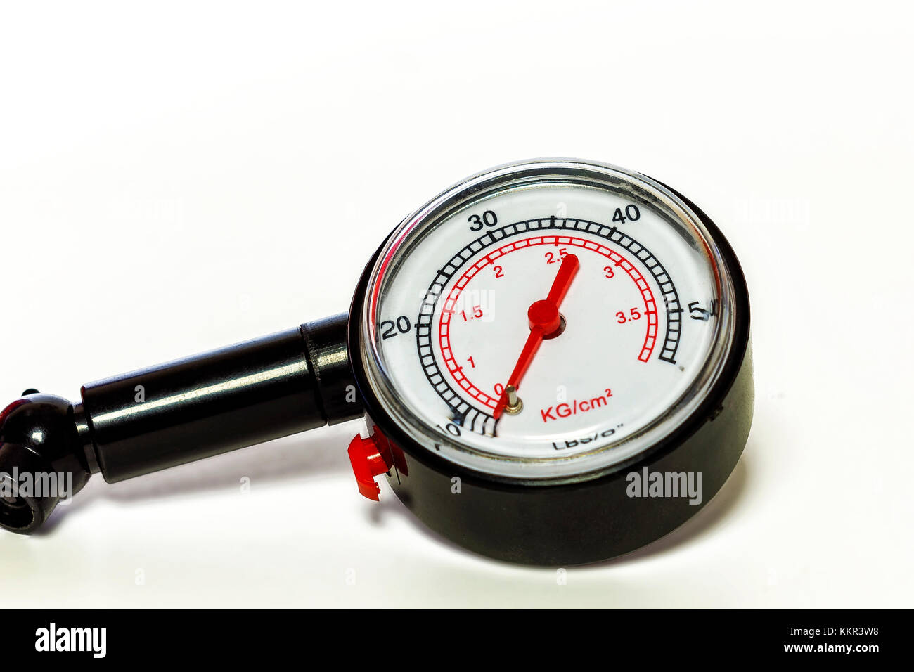 On a white background a closeup of a pressure gauge gauge for
