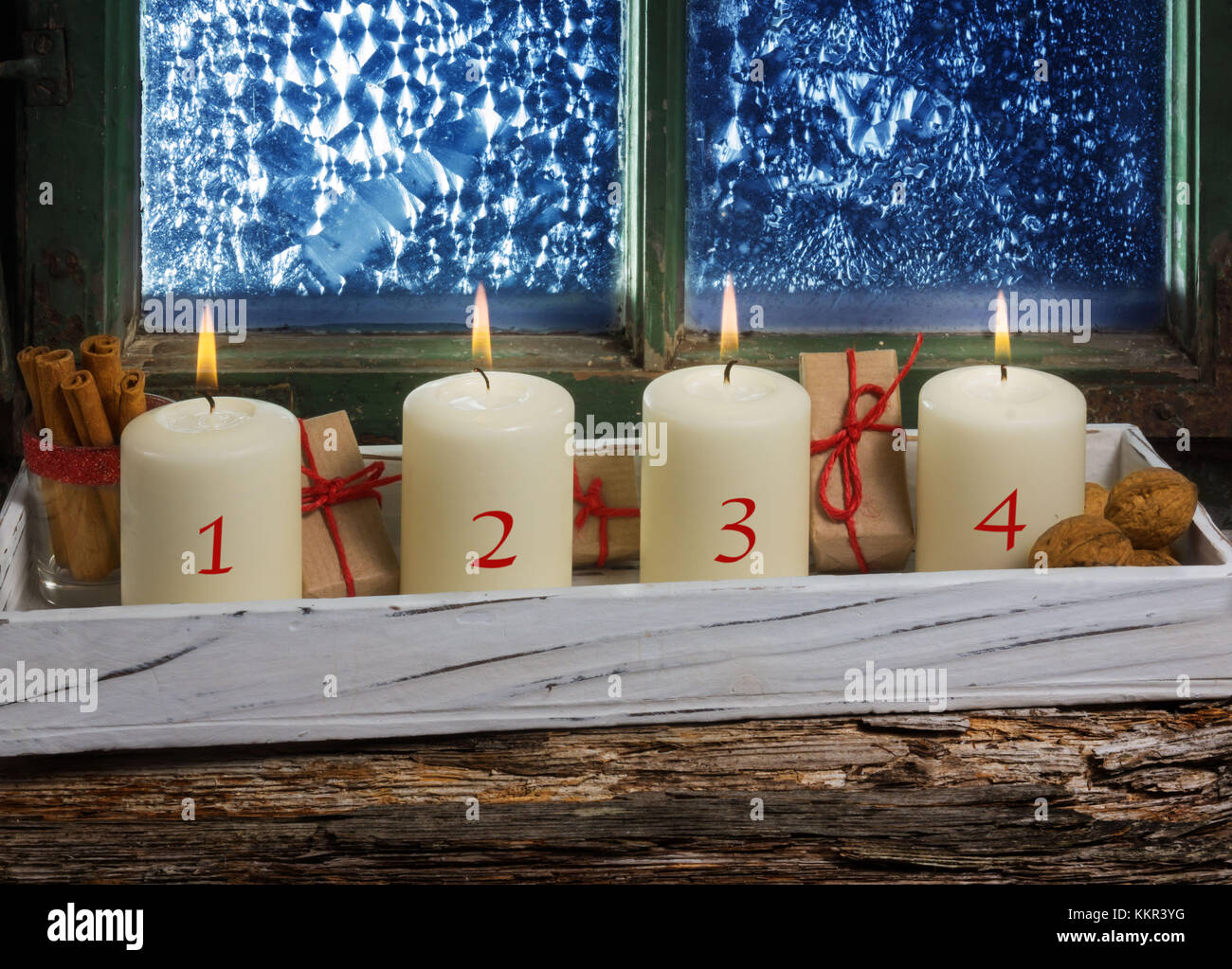 Advent decoration, four candles at the window Stock Photo Alamy