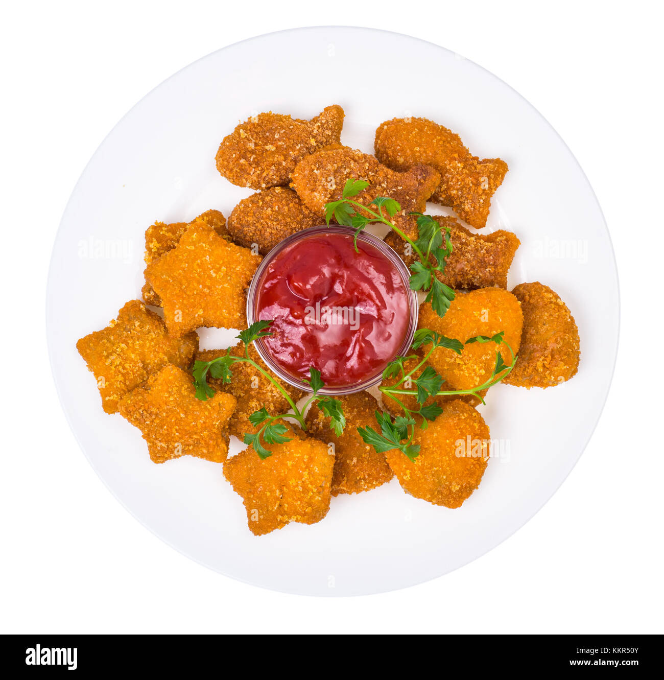 Nuggets of different shapes with ketchup on white background Stock Photo
