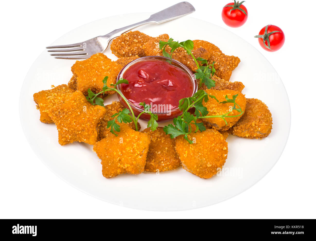 Nuggets of different shapes with ketchup on white background Stock