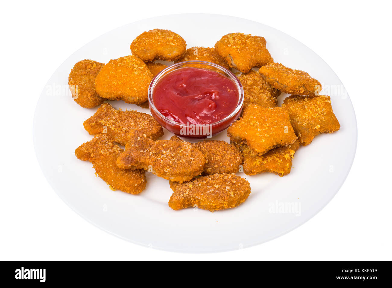 Nuggets of different shapes with ketchup on white background Stock Photo