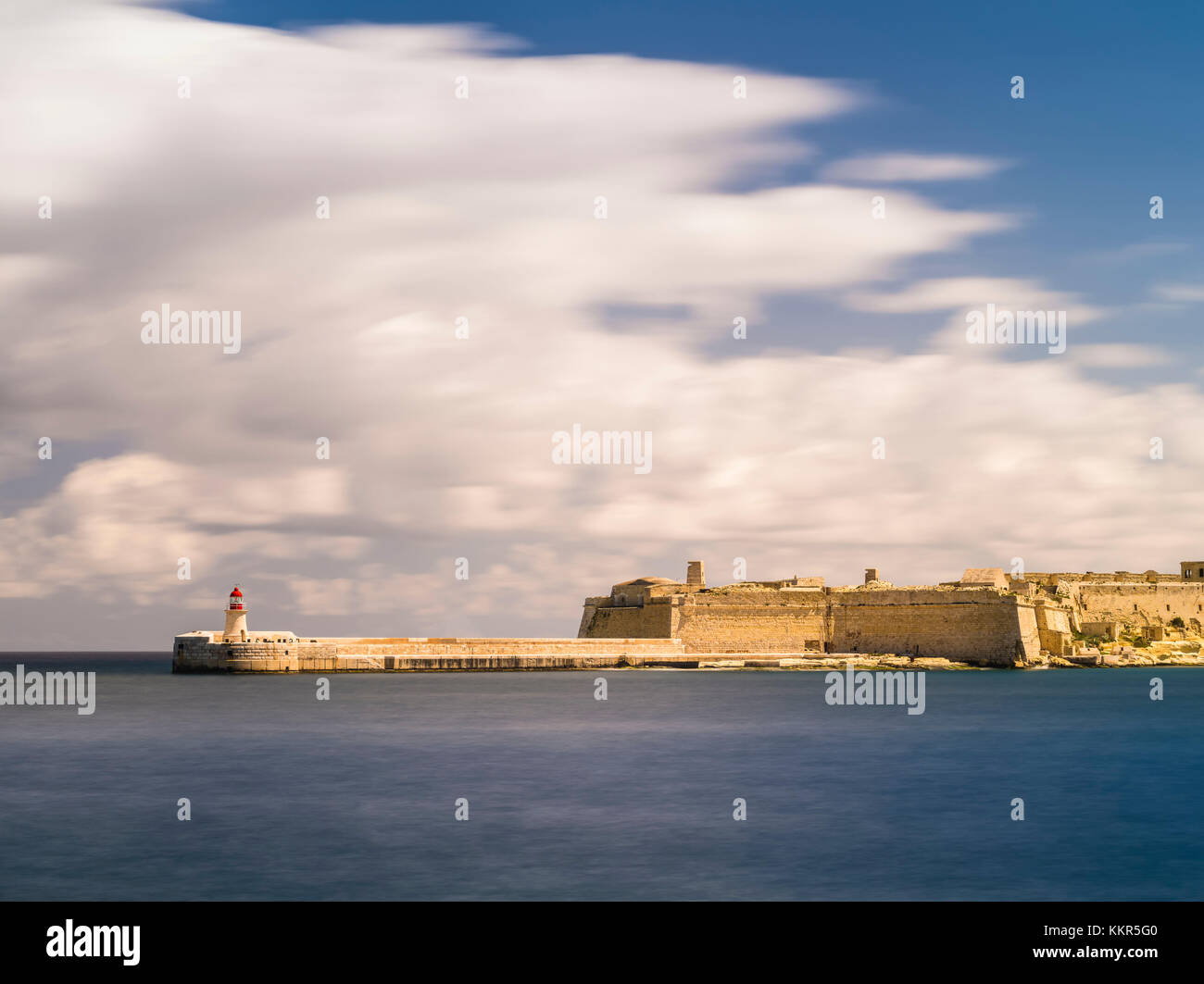 Harbour mole of Grand Harbour in Valletta on Malta with clouds Stock Photo