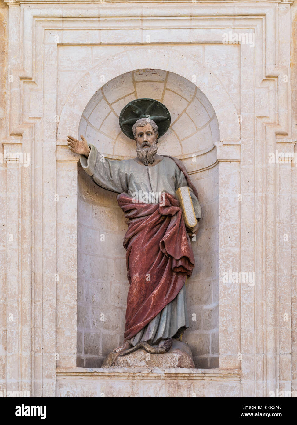 Statue of the apostle Paulus in the inner courtyard of the church of Mellieha on Malta Stock Photo