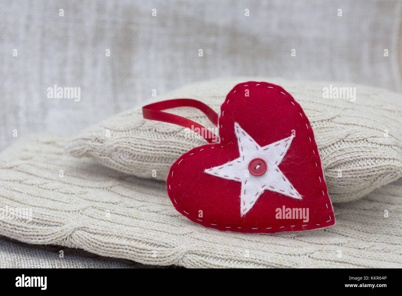 Heart cushions with star of Bethlehem as a token of love, still life Stock Photo