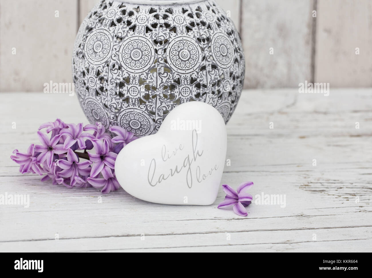 Hyacinth flowers with vase and heart shape, close up, still life Stock