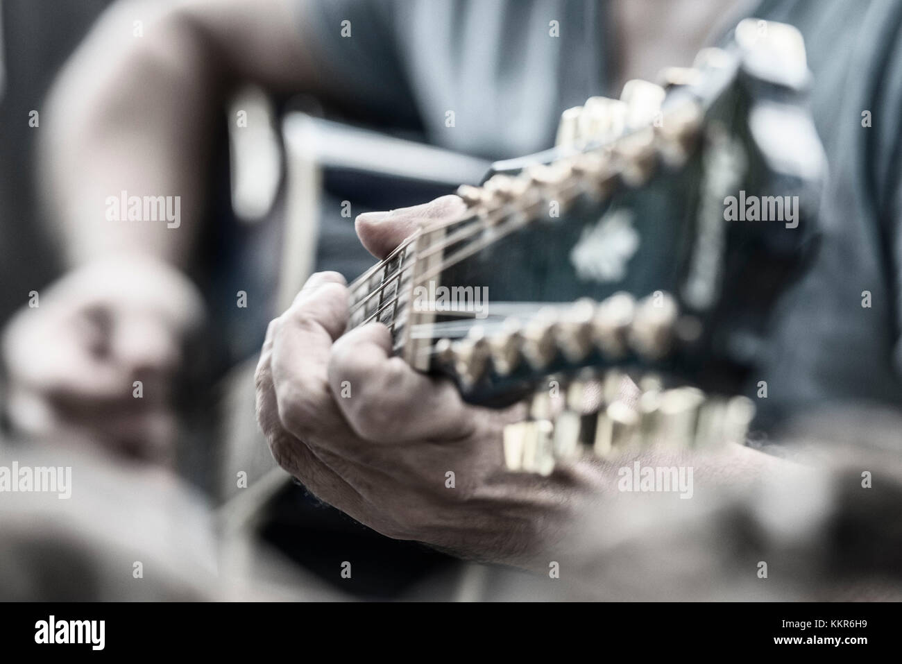 Breuberg, Hessen, Germany. Hands playing the guitar, selective sharpness. Stock Photo