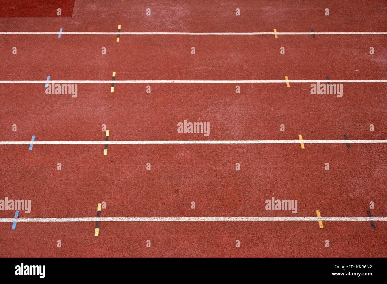 close-up and diagonal perspective to 100 m track in a stadium with markings. Stock Photo