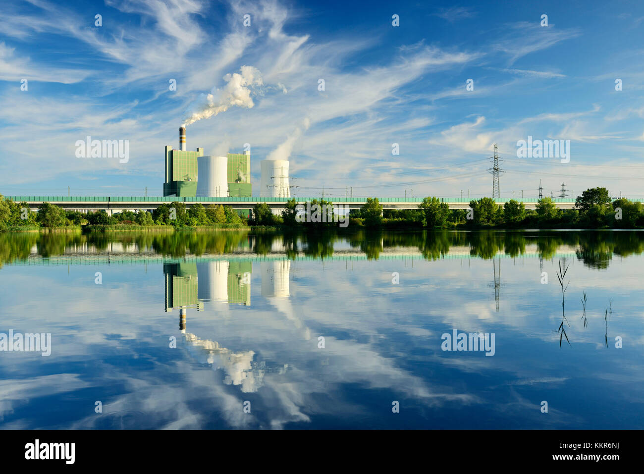 Germany, Saxony-Anhalt, Schkopau, brown coal power station is reflected in pond Stock Photo