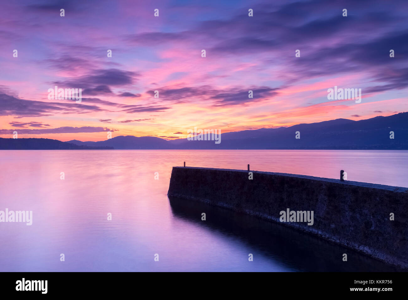 Sunset at the old pier, Lake Maggiore, Ispra, Varese Province, Lombardy, Italy. Stock Photo