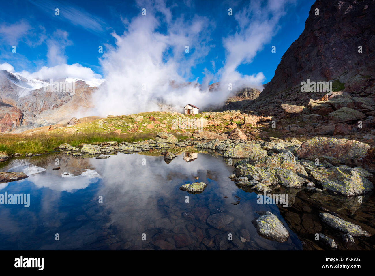 Pond at Larcher refuge Europe, Italy, Trentino region, Venezia valley, Sun valley, Pejo, national park Stelvio Stock Photo