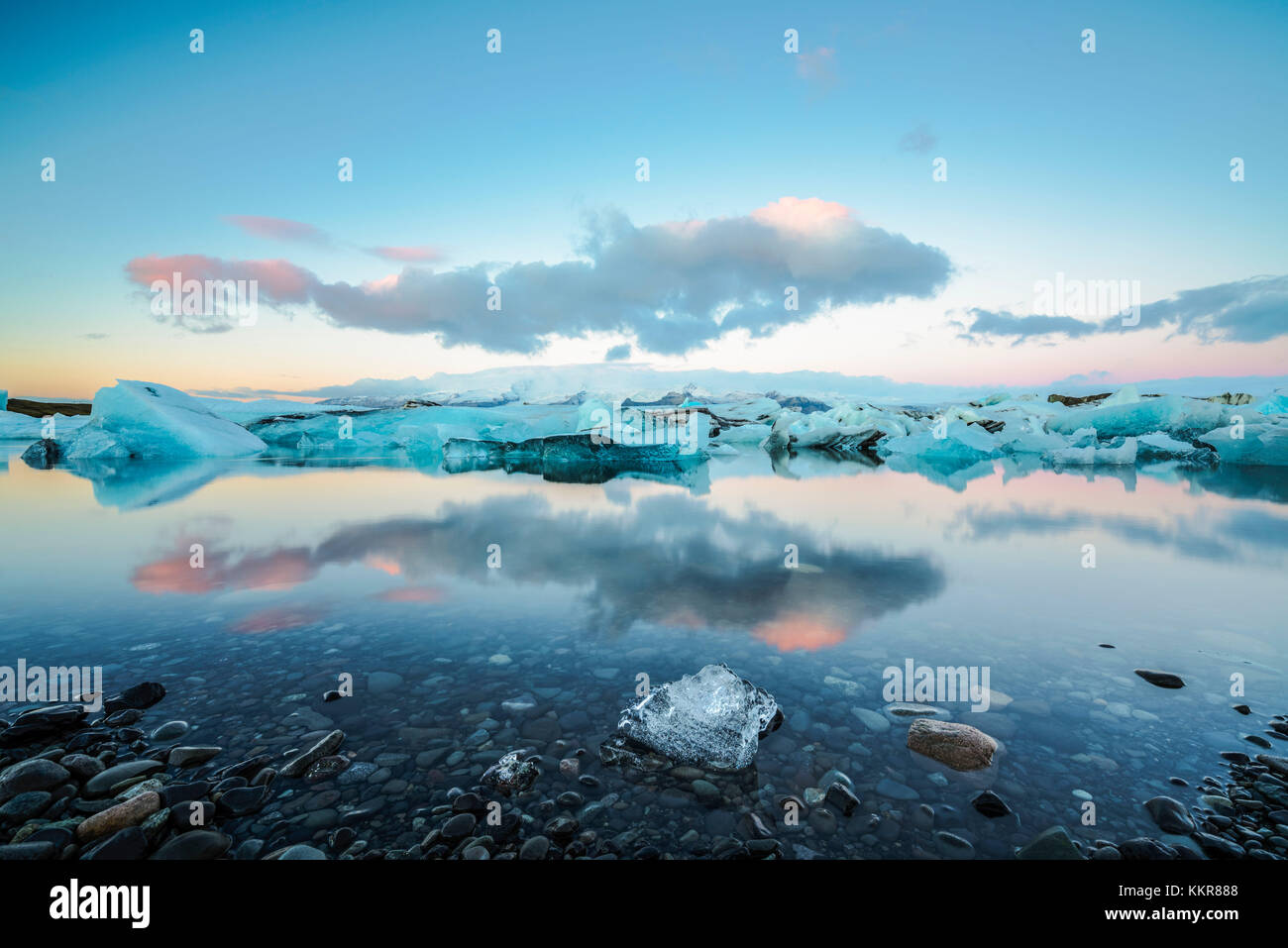 Jokulsarlon, Eastern Iceland, Iceland, Northern Europe. The iconic little icebergs lined in the glacier lagoon during a sunrise Stock Photo