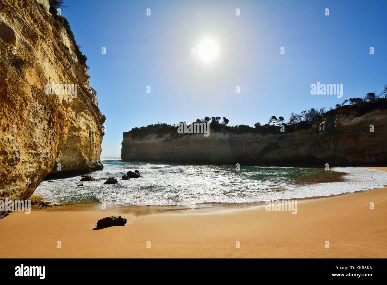 Sea Bay with Sandy Beach and Sun, Loch Ard Gorge, Port Campbell, Great Ocean Road, Victoria, Australia Stock Photo
