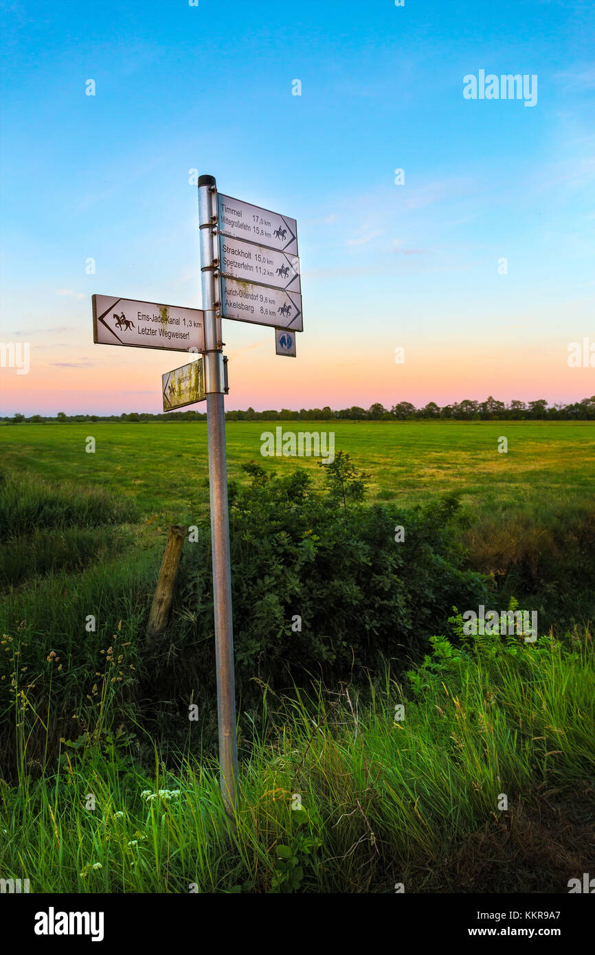 A roadsign for horse riders near Wiesmoor, East Frisia at sunset Stock Photo