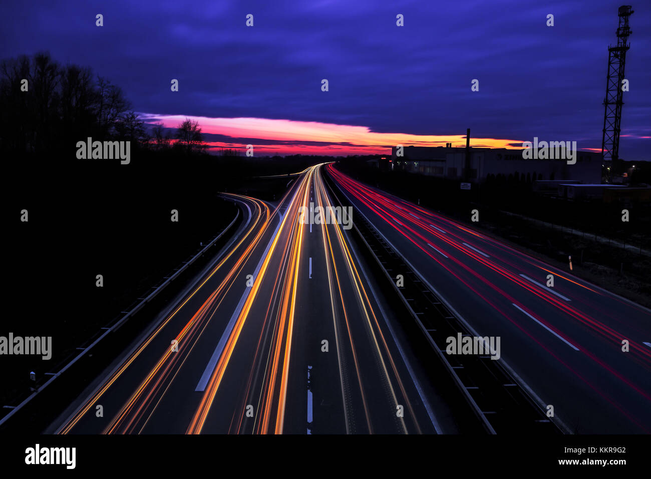 Car lights on a Freeway near Apen at Sunset Stock Photo