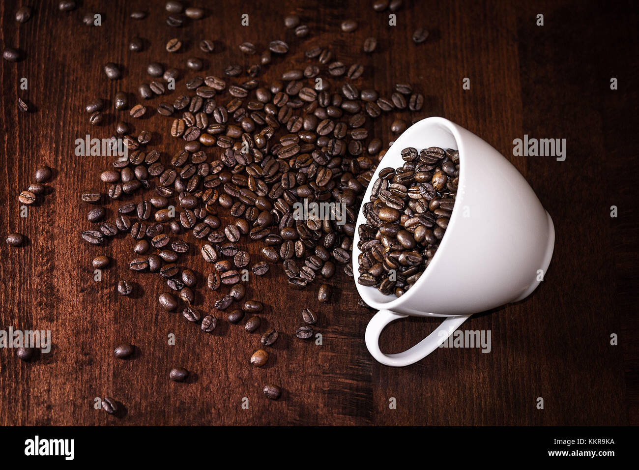 Dropped beans on a brown table Stock Photo