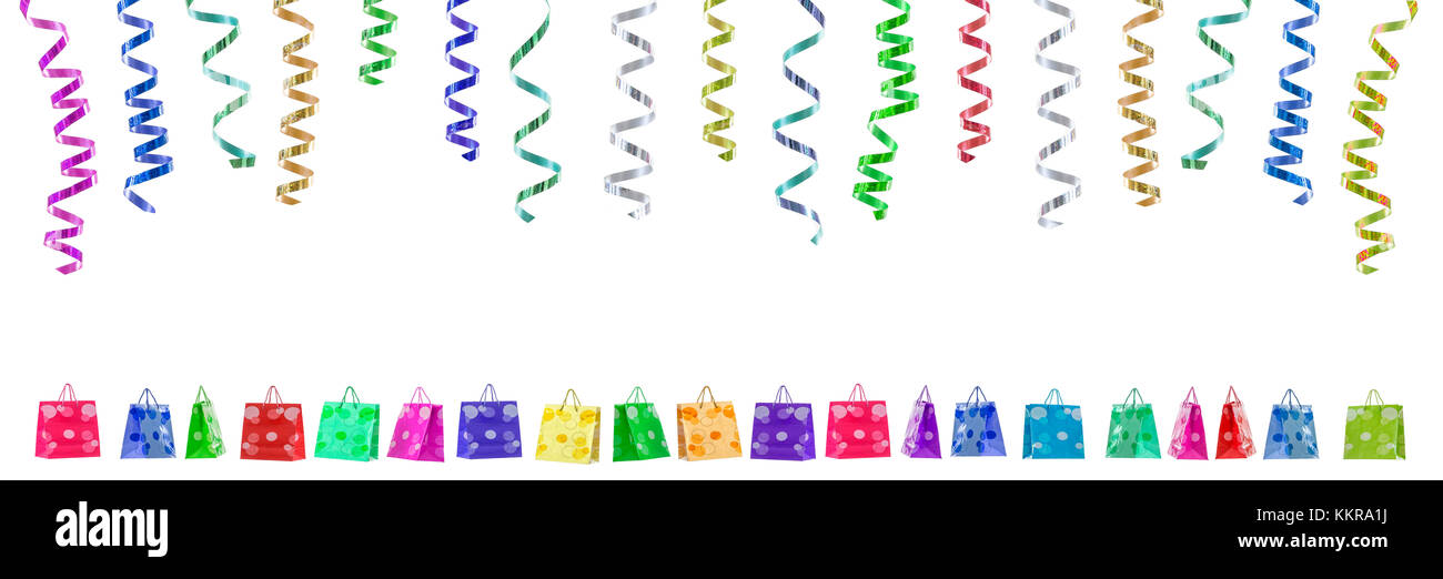 Panoramic festive image with rolls of curly ribbons hanging on top and multi coloured gift bags on the gound on white Stock Photo