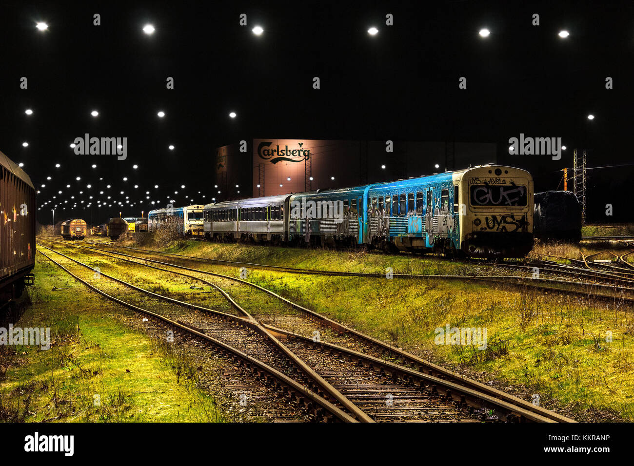 Trains at an illuminatet train depot in Fredericia Stock Photo