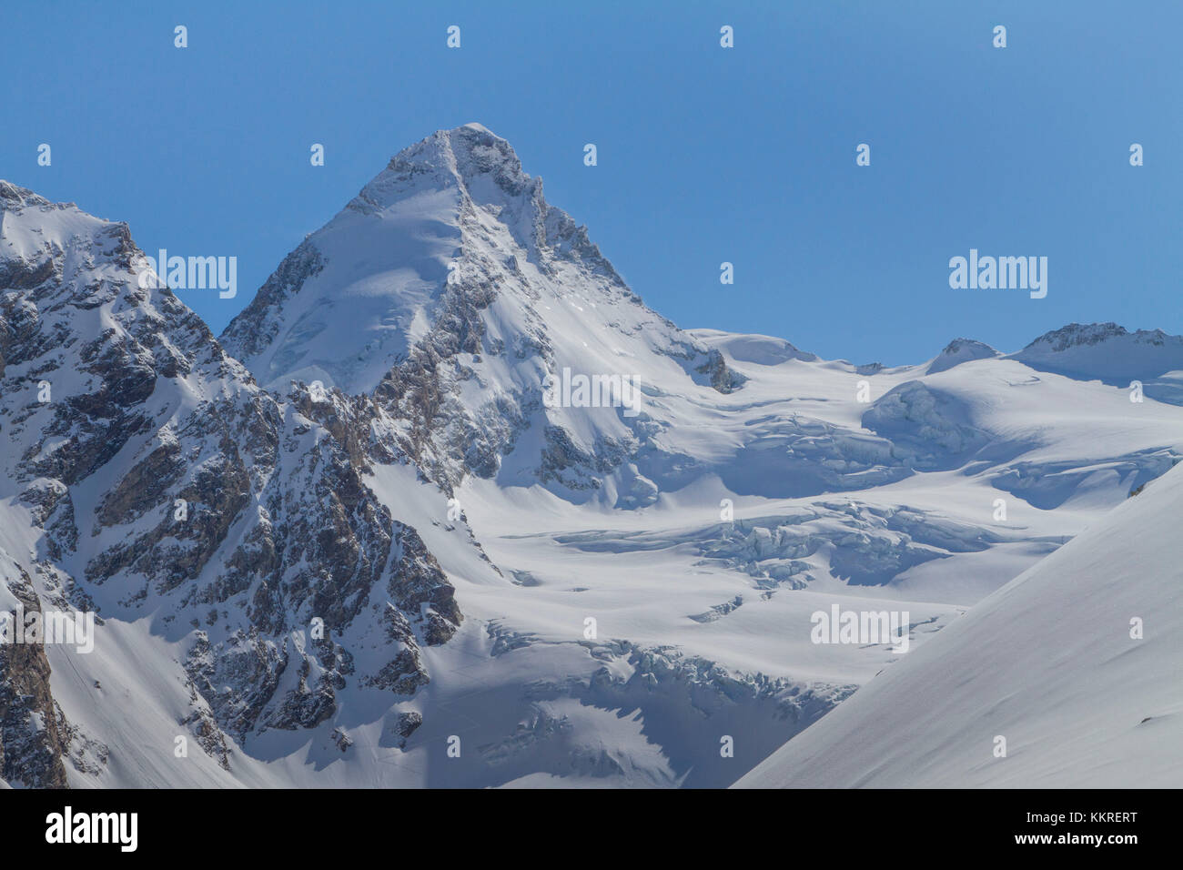 The summit of Dent d'Herens and glaciers of Swisse Alps near Zermatt, Suisse Stock Photo