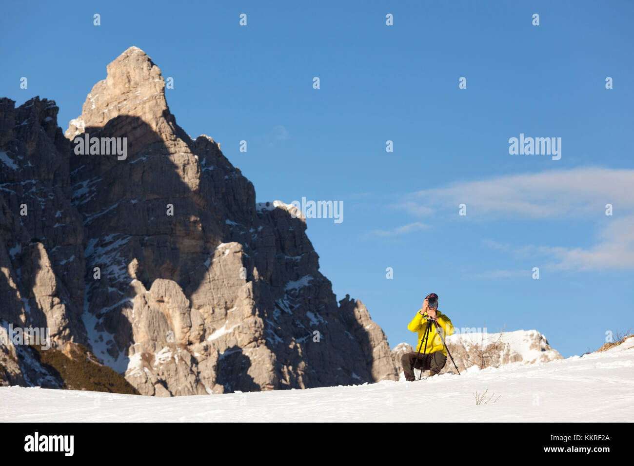Mountian photographer in front of Rocchetta di Ruoibes, Dolomites, Borca di Cadore, Belluno, Veneto, Italy Stock Photo