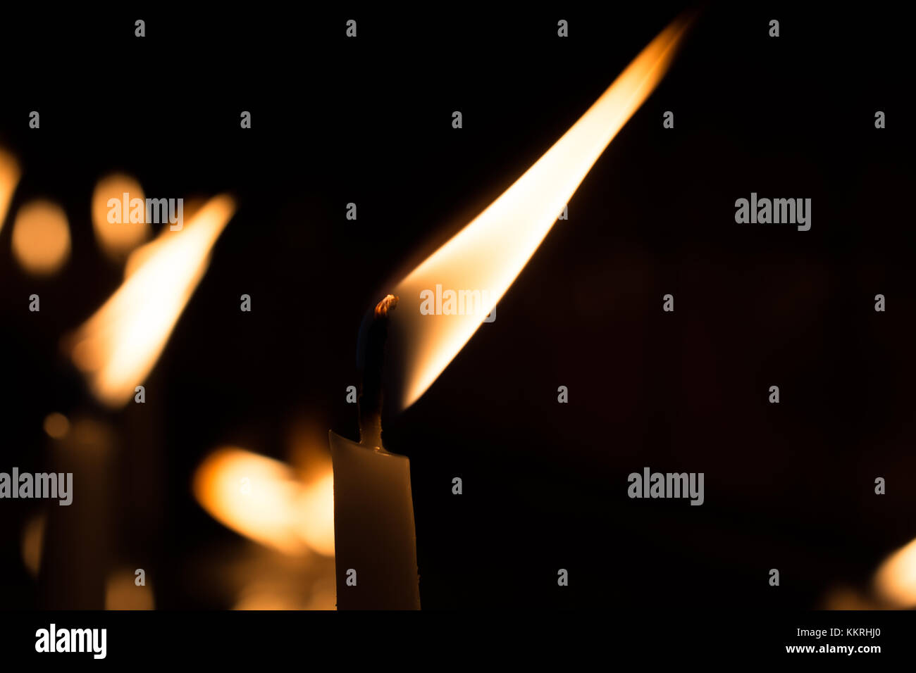 Burning candles with candle light in the dark Stock Photo Alamy