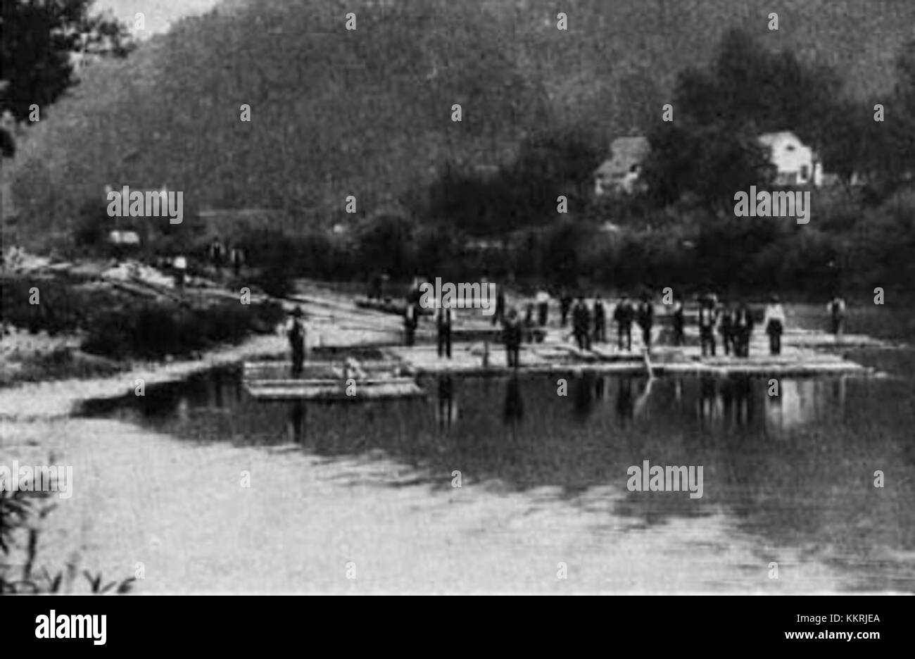 This image shows traditional log drivers (splavarji) from the Upper Savinja Valley, situated before the Grenadierwirt restaurant. These workers, known for navigating timber down the Savinja River, are an important part of the region’s cultural and industrial history. Stock Photo