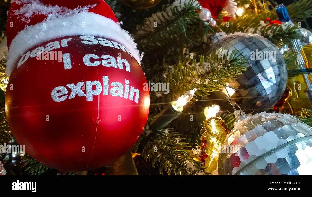 Santa I can explain Christmas ball on tree with santa hat hanging with retro ornaments - close-up Stock Photo