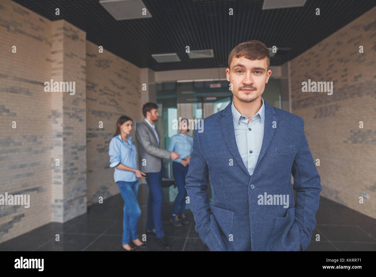 Handsome smiling confident businessman portrait Stock Photo - Alamy