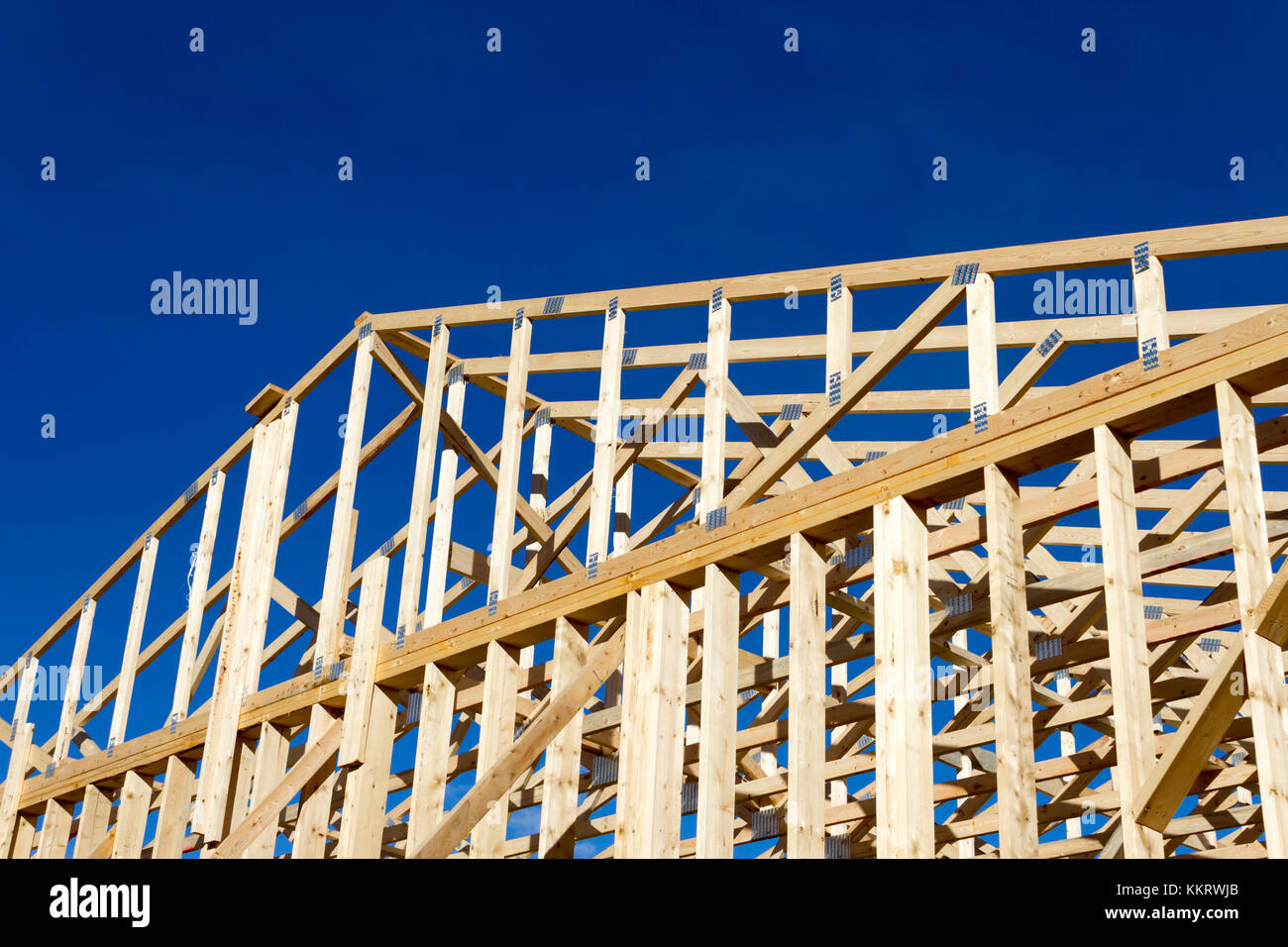 Wood construction frame of housing development detached house construction site using lumber 2X4